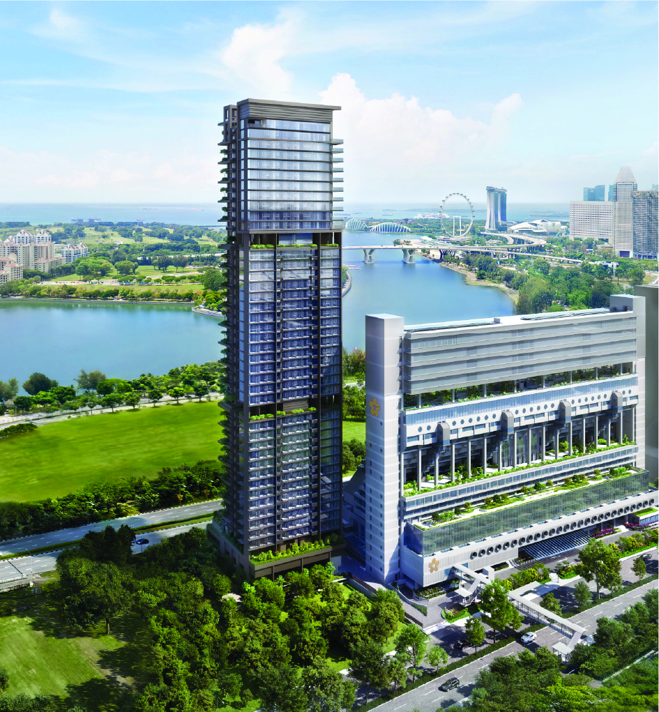 Tall glass skyscraper with a connected podium building beside a river and green park nearby.